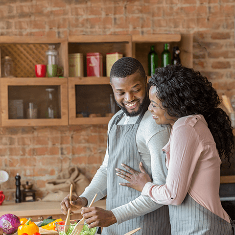 Mature couple cooking together